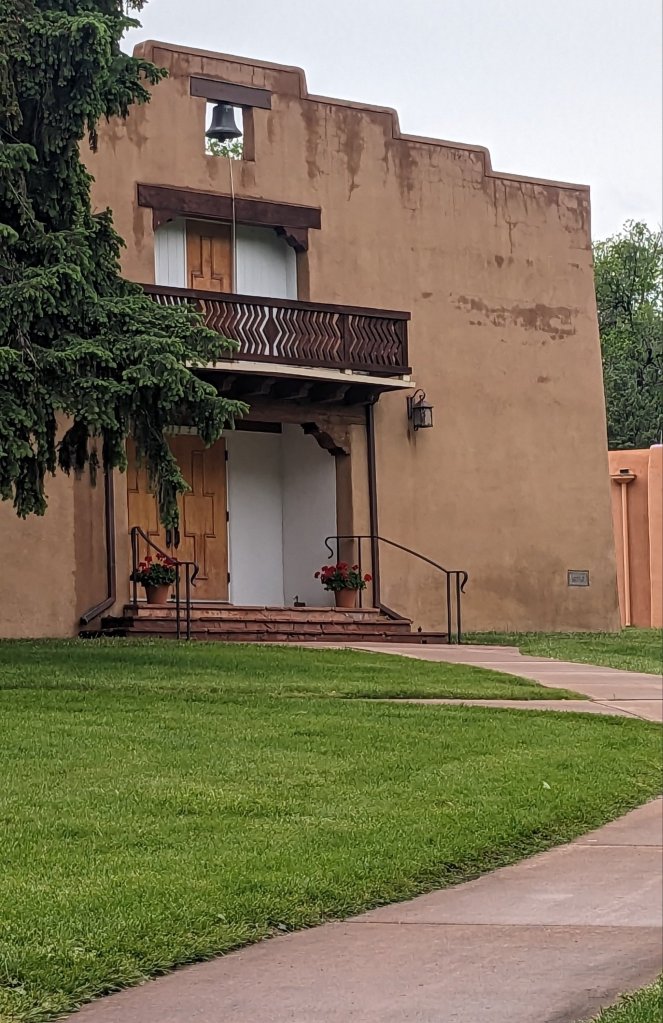 Fountain Valley School chapel building - adobe with Spanish style wood balcony, and large brass bell.