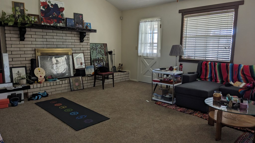 Living room with all art in one place near the fireplace